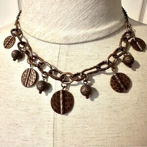 Copper tone charm necklace